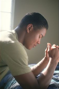 man-praying-on-his-knees