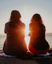 women-talking-beach